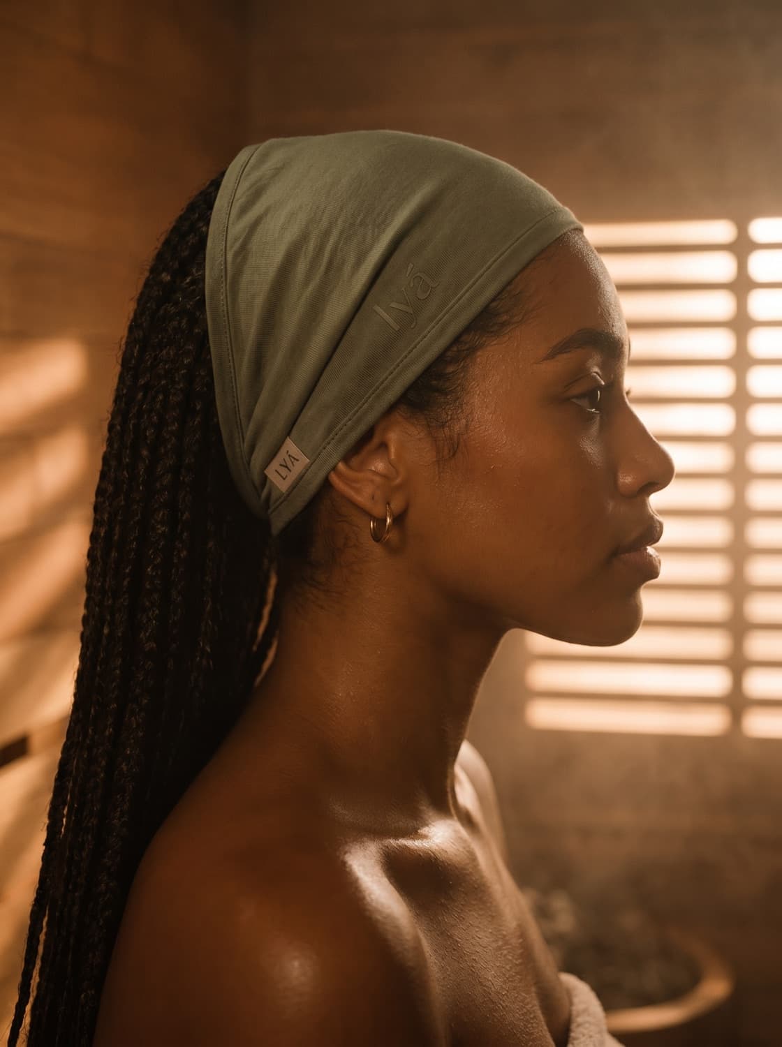 Sauna cover in sage — worn, profile in the studio