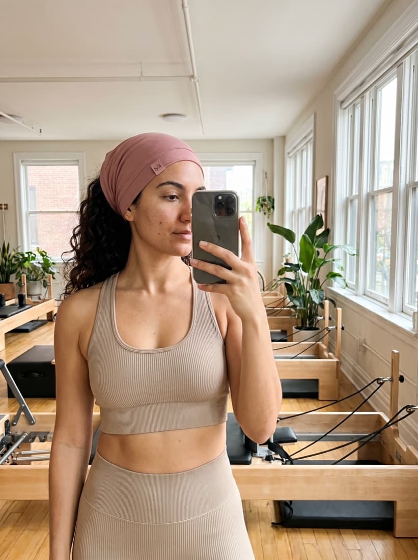 Wearing the cover at a pilates studio mirror
